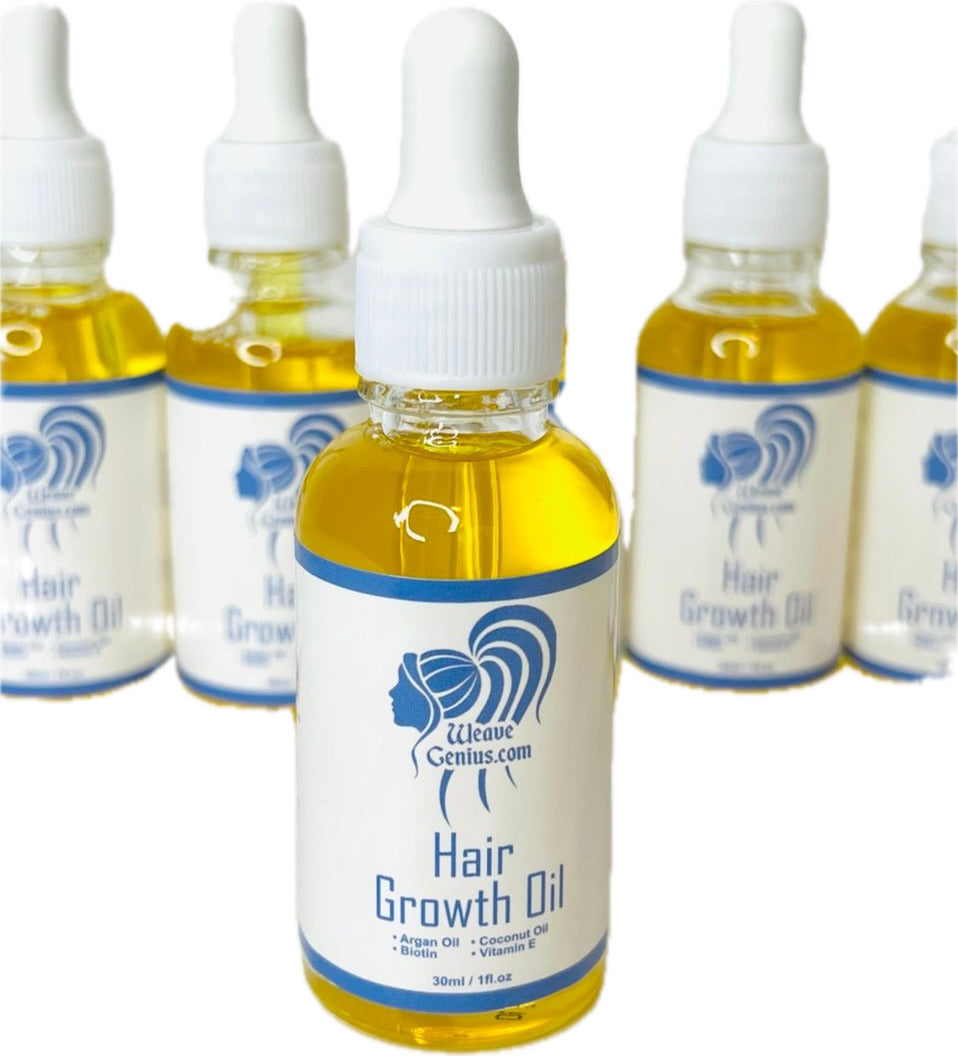Bottles of Hair Growth Oil with visible branding on a white background